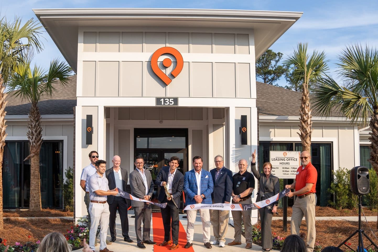 Ribbon cutting outside a Hillpointe leasing office